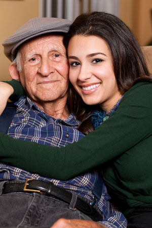Granddaughter hugging grandfather